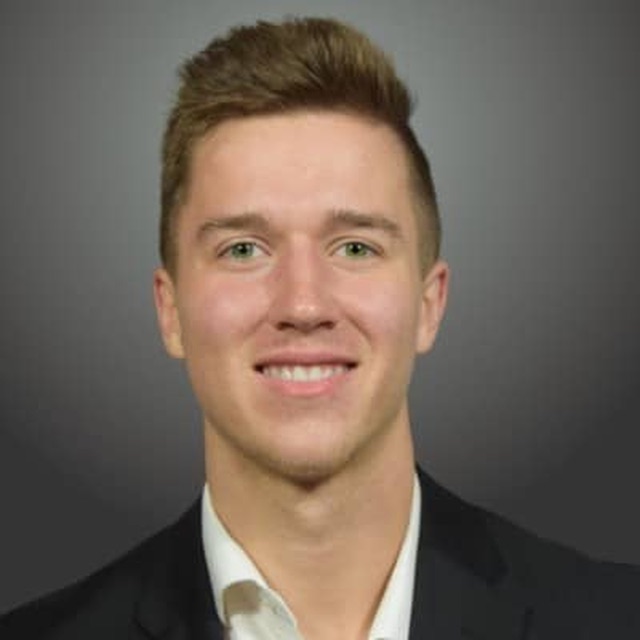 Will Granchi, photographed head and shoulders against a plain background.